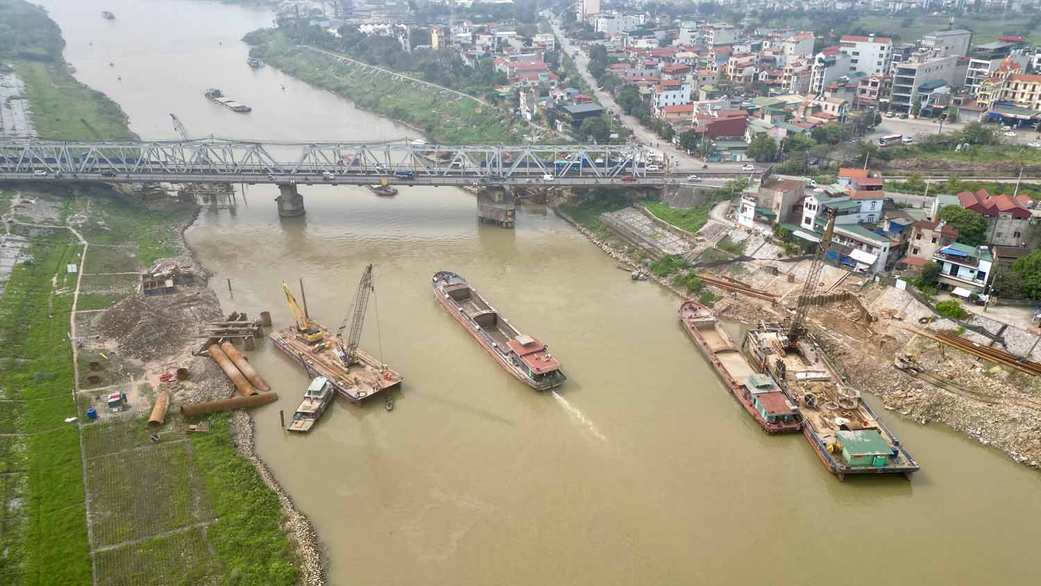 Bộ Xây dựng đề nghị đẩy nhanh tiến độ GPMB dự án cầu đường bộ vượt sông Đuống - Ảnh 1.